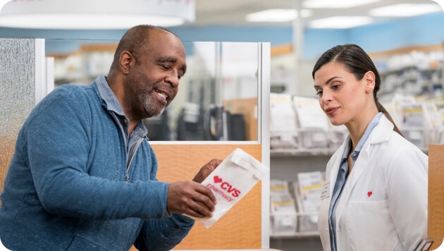 Pharmacist consulting with a patient